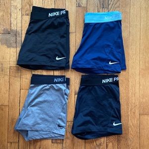Four pairs Nike pro 3 inch compression shorts